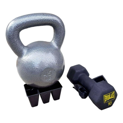 Silver kettlebell and black dumbbell on top of seed trays on a white background 