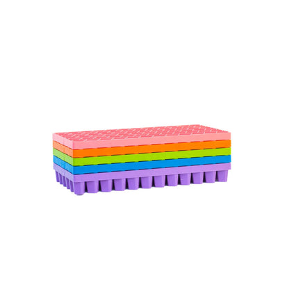 Stack of colorful propagation trays on a white background 