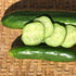 Whole and sliced Persian cucumbers on a woven surface